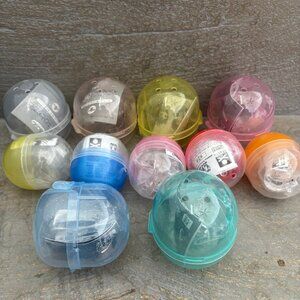 11 Japanese empty gachapon capsules
